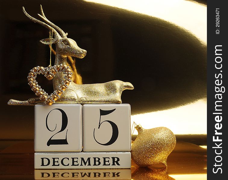 Gold theme Save the Date calendar for Christmas Day, December 25, with bauble and reindeer decorations. Gold theme Save the Date calendar for Christmas Day, December 25, with bauble and reindeer decorations.