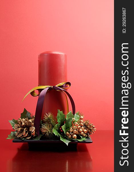 Red Candle With Holly And Pine Cone Christmas Table Centrepiece Still Life