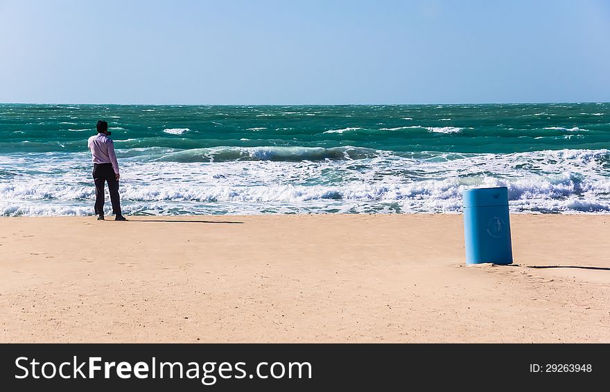 Unidentified individual takes the picture of the sea by the smart phone, on the municipal beach in Dubai, UAE. Unidentified individual takes the picture of the sea by the smart phone, on the municipal beach in Dubai, UAE.