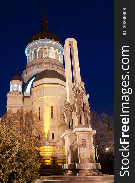 The Orthodox Cathedral of Cluj, Feleacu and Vadu, Dormition of the Theotokos, Northern side. Monument of the Romanian soldier in the foreground. Viewed at the blue hour. The Orthodox Cathedral of Cluj, Feleacu and Vadu, Dormition of the Theotokos, Northern side. Monument of the Romanian soldier in the foreground. Viewed at the blue hour