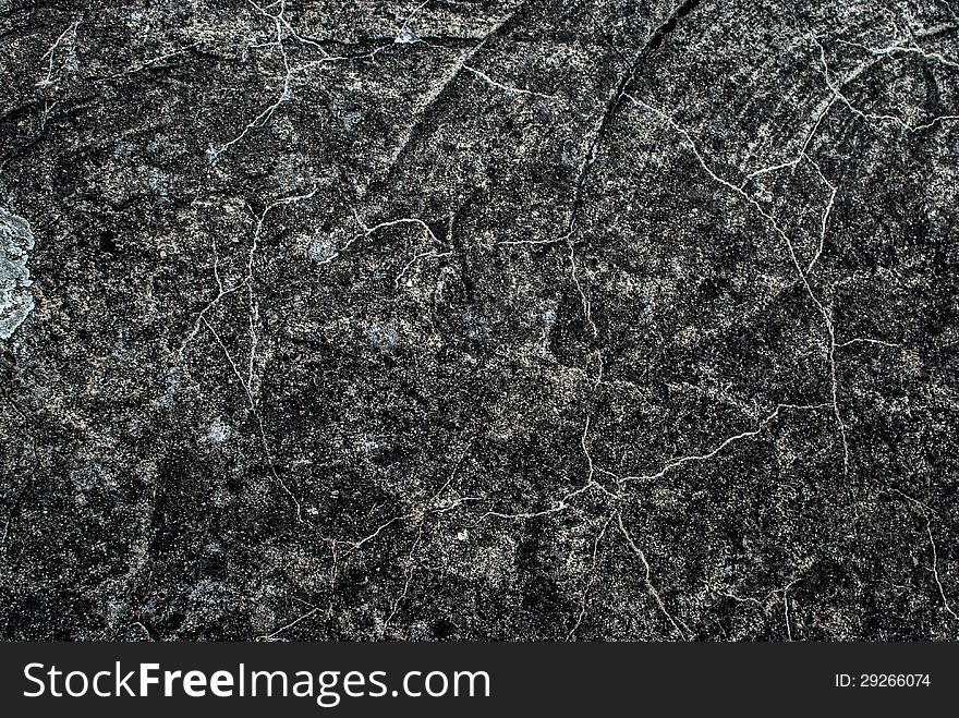 Background from a gray rough surface of stone of rock