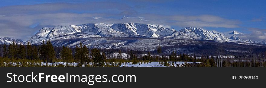 This panorama image shows the Livingston Range of mountains as seen from the North Fork Road in NW Montana not far from the US/Canada border.
