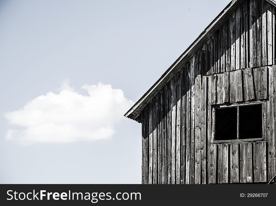 Facade of the old wooden house with window