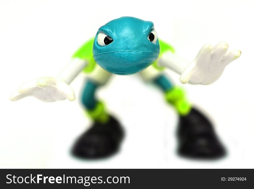 Toy monster figure with blue skin over white