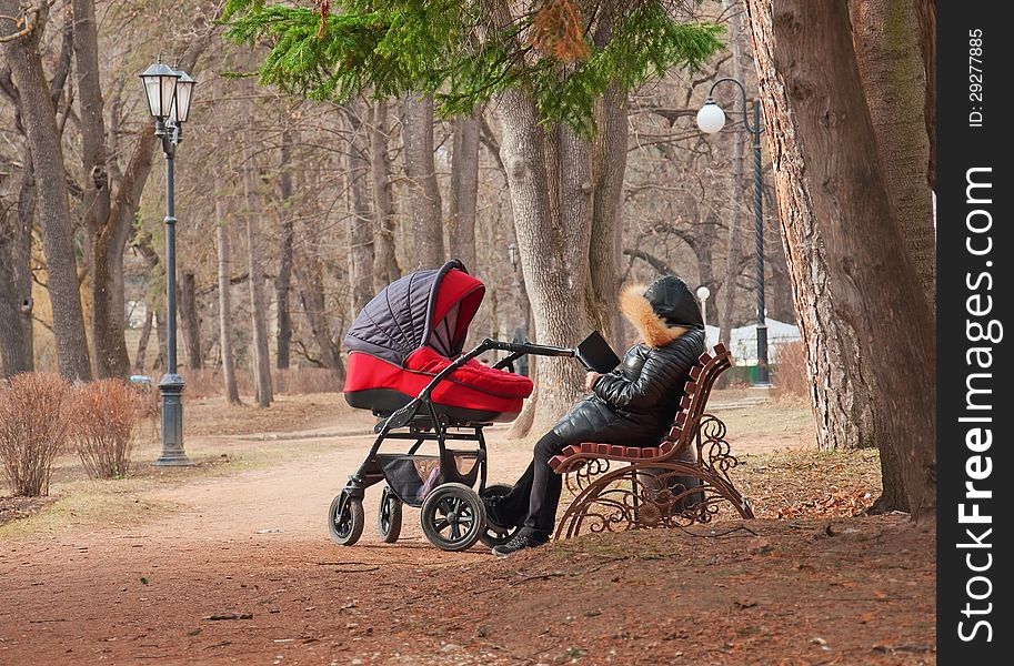 Woman on a bench with a book