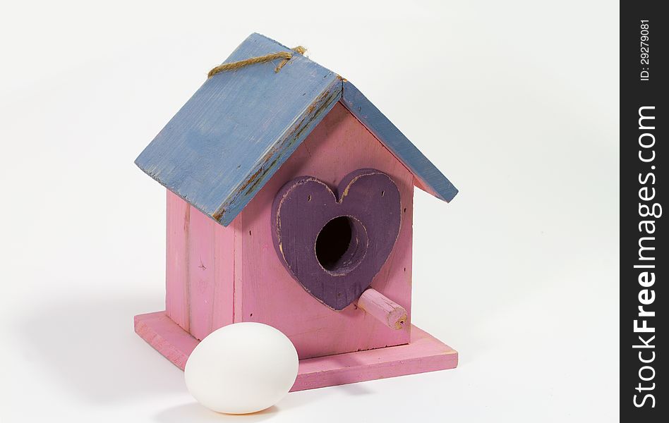 The birdhouse with the egg waiting for the bird. The birdhouse with the egg waiting for the bird.