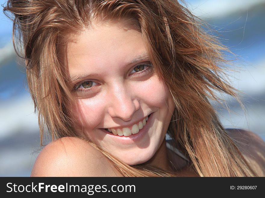 Closeup of a young woman on the beach. Closeup of a young woman on the beach