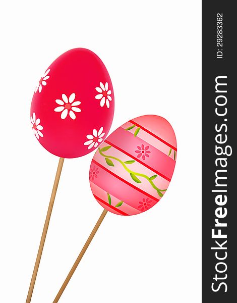 Two colorful Easter eggs with floral patterns on wooden sticks isolated on a white background