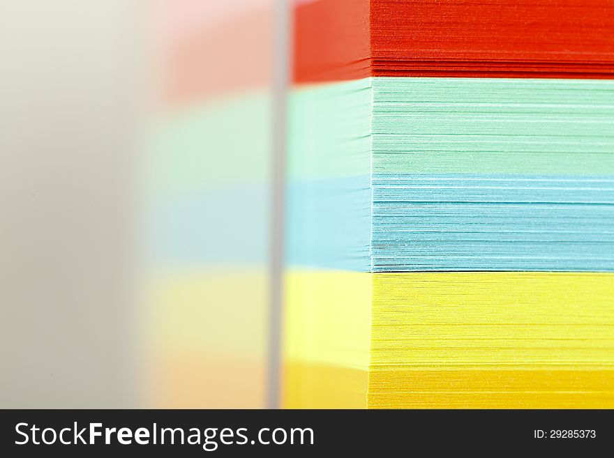 Closeup view of a block of colorful postits. Closeup view of a block of colorful postits.