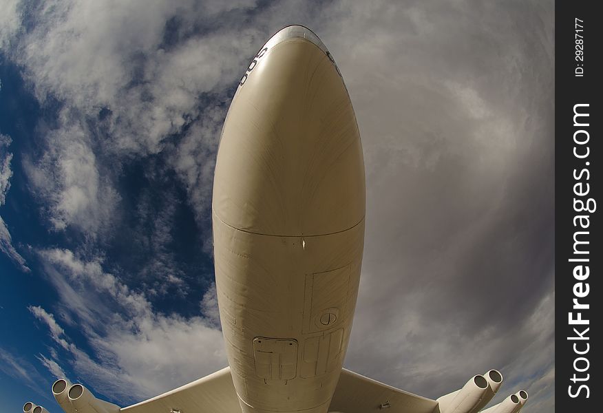 Underneath a large flying plane. Underneath a large flying plane