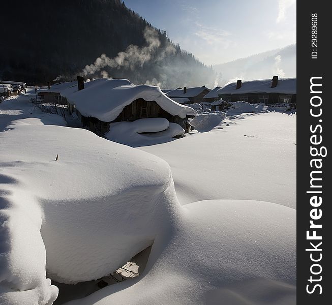 THe Accumulated snow beside the farmhouse in the winter , china. THe Accumulated snow beside the farmhouse in the winter , china.