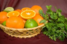 Oranges And Limes In A Basket Stock Photography Oranges And Limes In A Basket Stock Photography