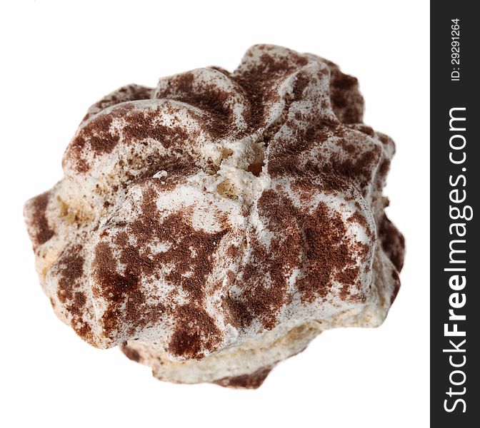 Upper view of a custard cake cover in cocoa powder isolated against a white background.