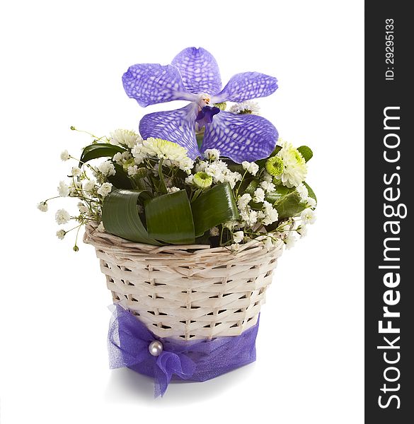 Bouquet of vanda and chrysantemums flowers in wicker vase isolated on white background. Bouquet of vanda and chrysantemums flowers in wicker vase isolated on white background