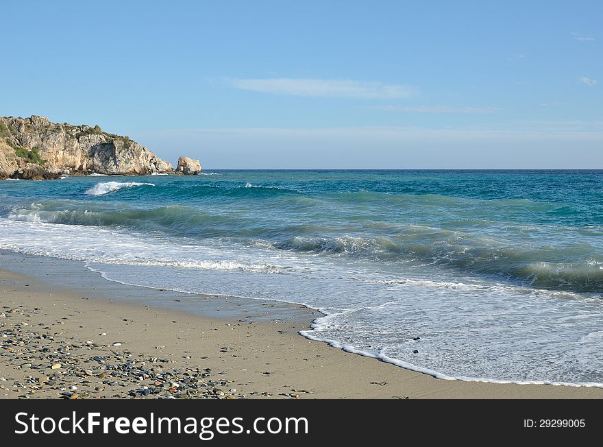 Waves run on the wild sandy beach of the Mediterranean sea. Waves run on the wild sandy beach of the Mediterranean sea.