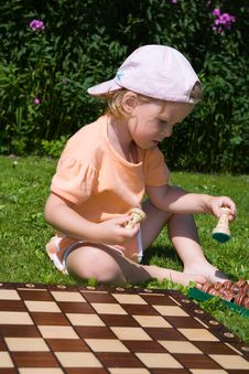 Girl Playing Chess Stock Photos