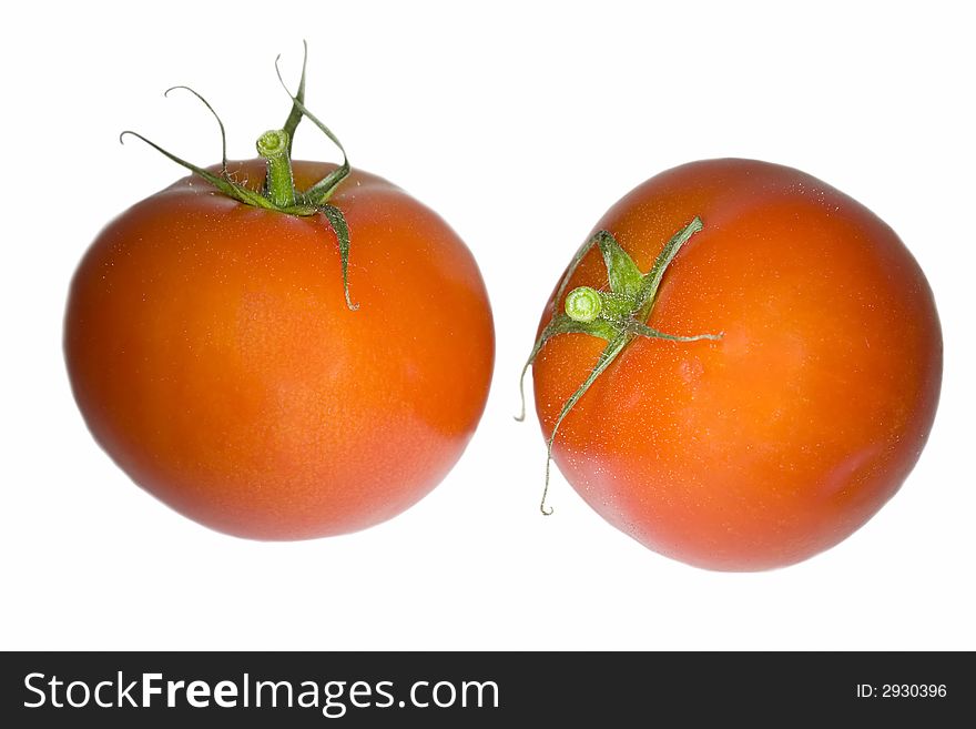 Two red tomatoes isolated on white background