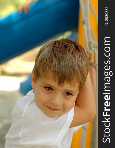 Handsome boy at outdoors playground