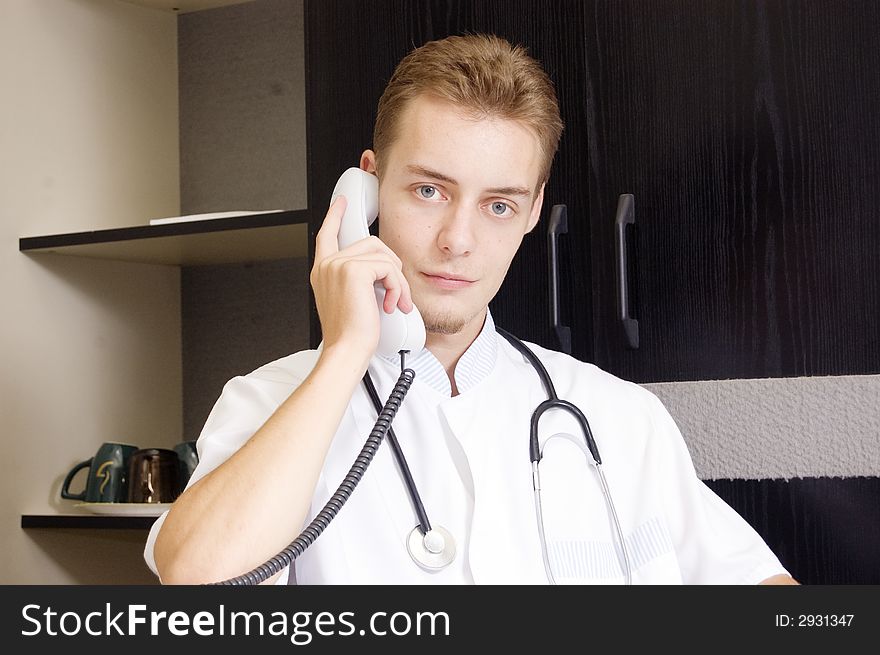 Doctor on the phone smiling. Doctor on the phone smiling