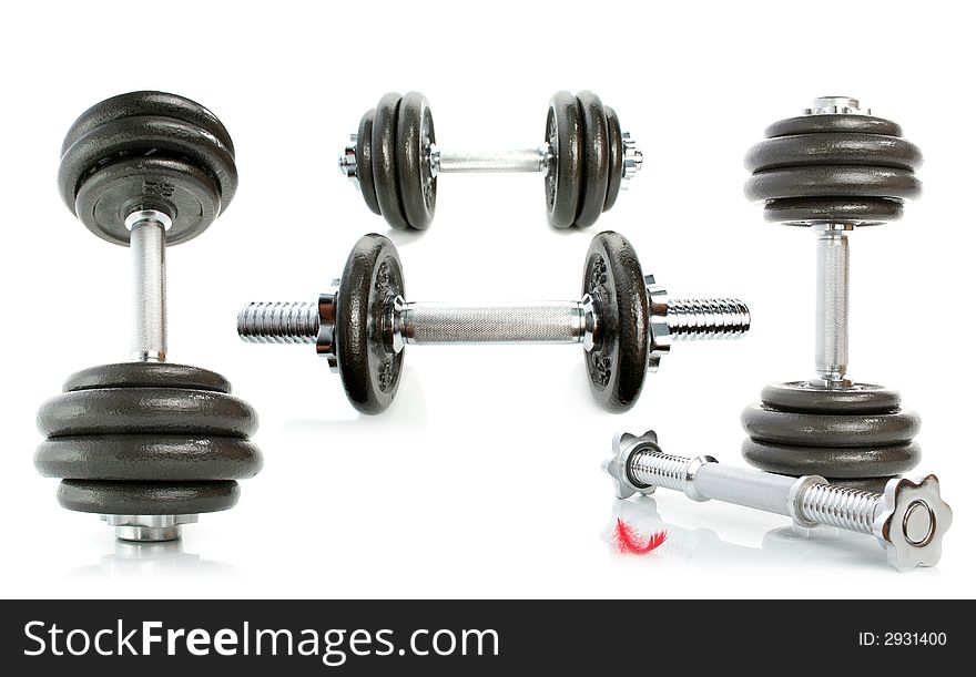 Set Of Iron Dumbbells On White