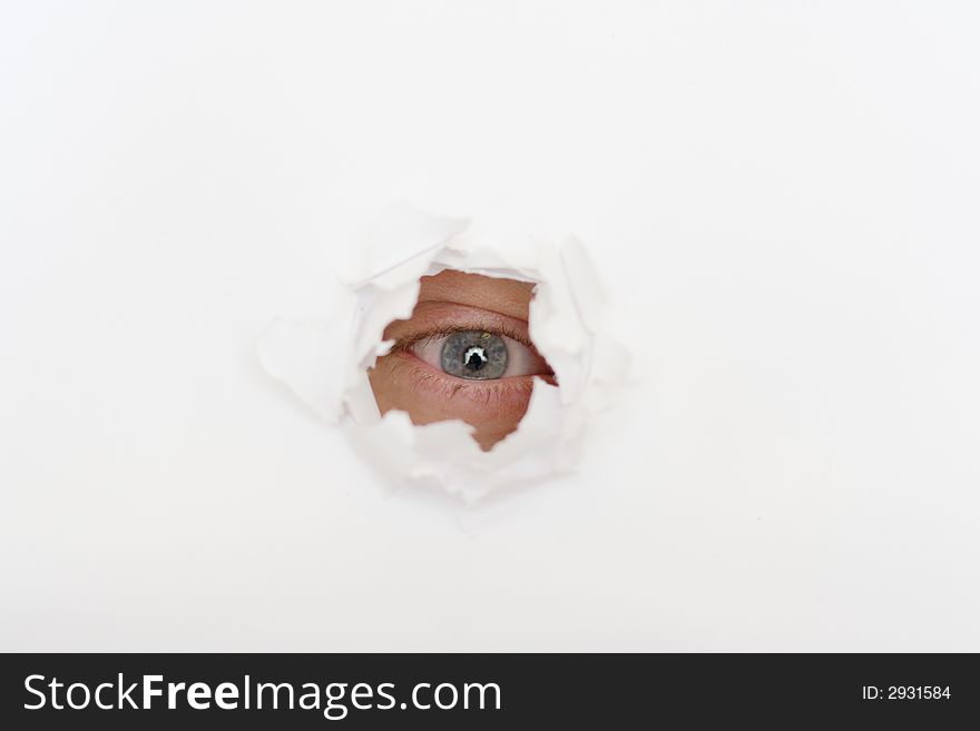 Eye In The Hole Of White Paper