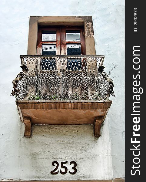 An intricate European window and balcony