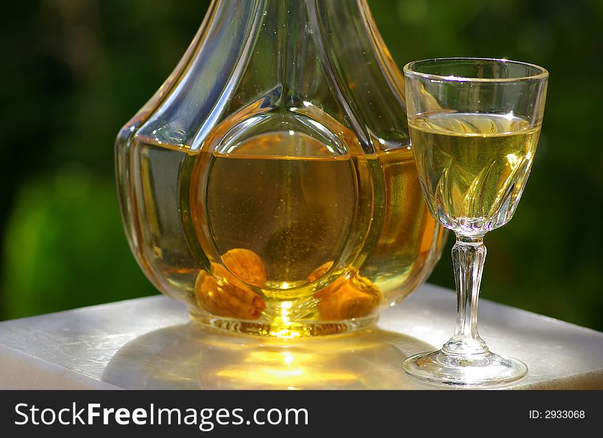 Bottle and glass with burning hot water of fig.