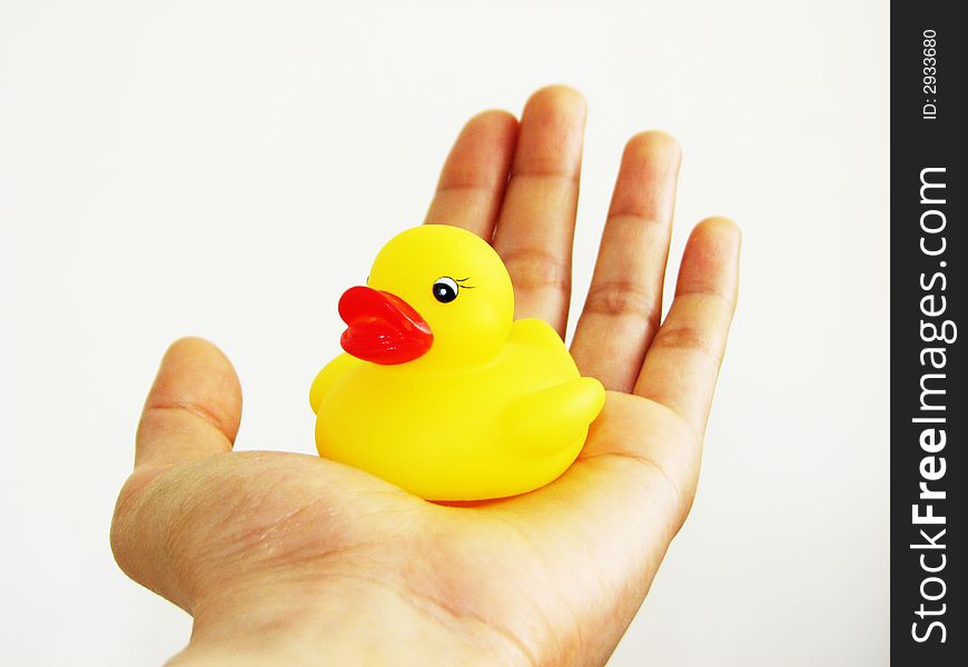 A mini rubber ducky resting in my hand. A mini rubber ducky resting in my hand.