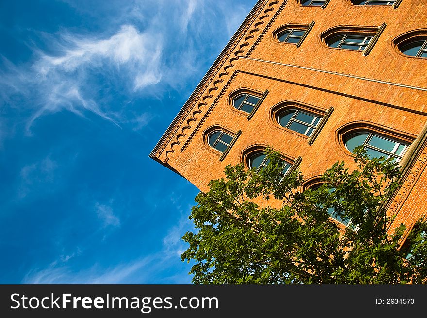 An office building taken at an interesting angle. An office building taken at an interesting angle