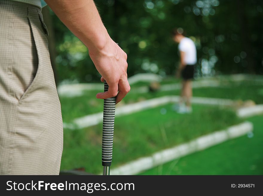 Game in a golf in solar summer day