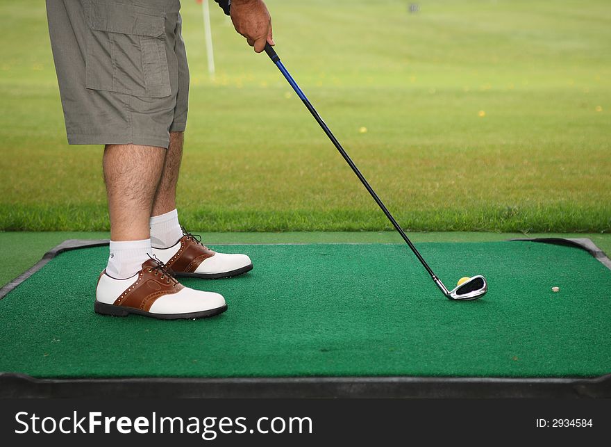 Senior golfer play golf in the city golf school field. Senior golfer play golf in the city golf school field