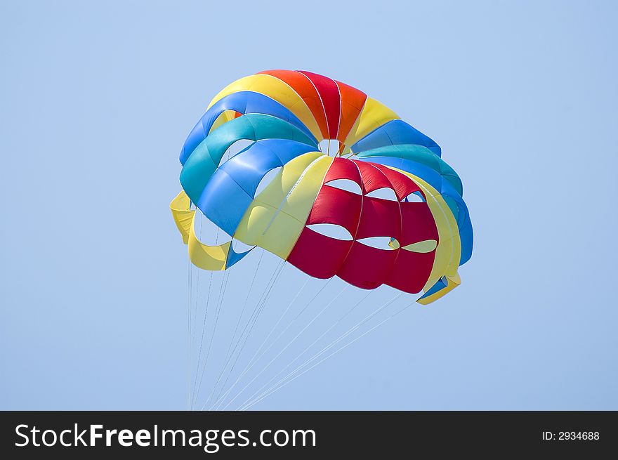 Macro of colorful parasailing parachute in the sky. Macro of colorful parasailing parachute in the sky