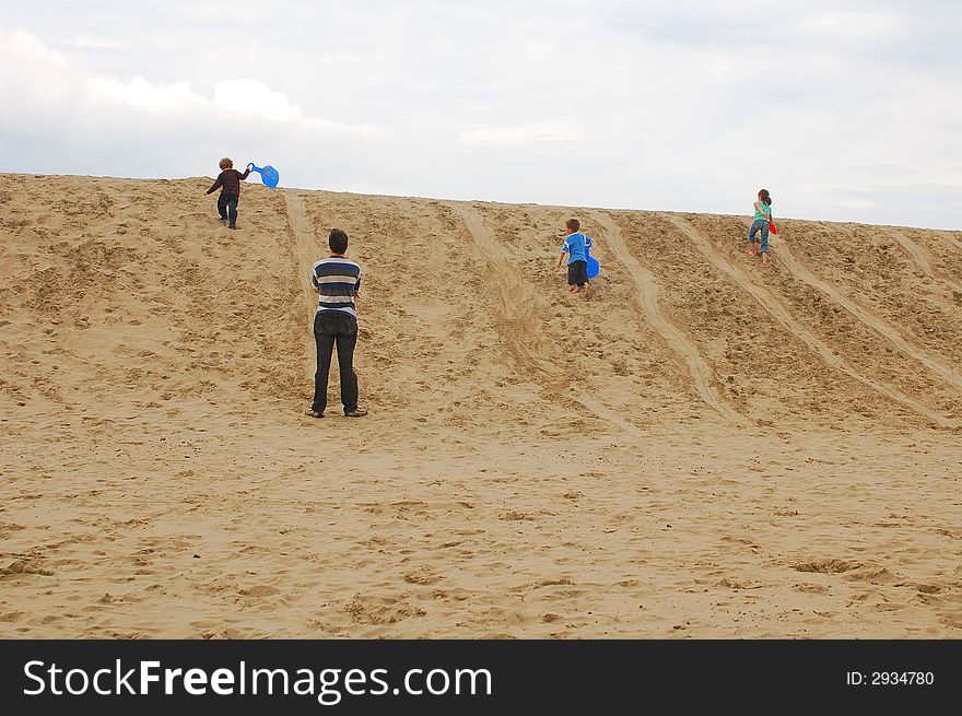 Family with children on dunes