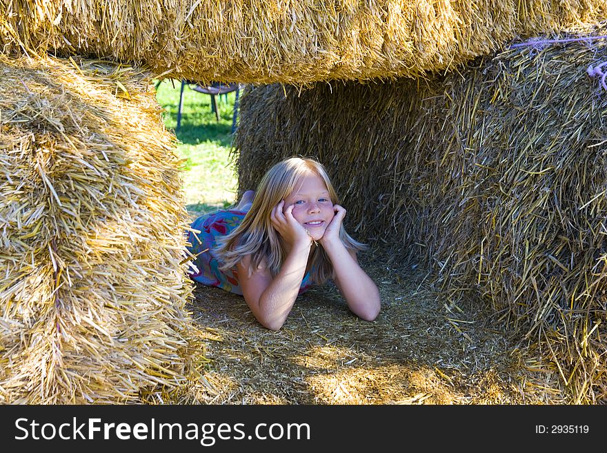 Cute Girl On Haybales