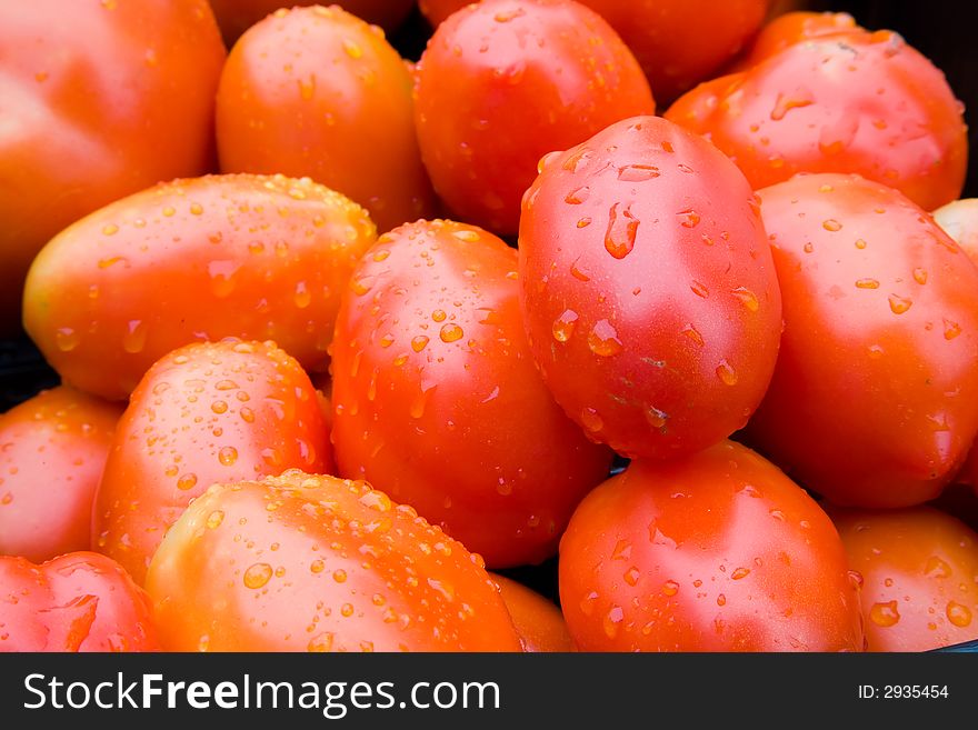 A bunch of red ripe tomatoes.