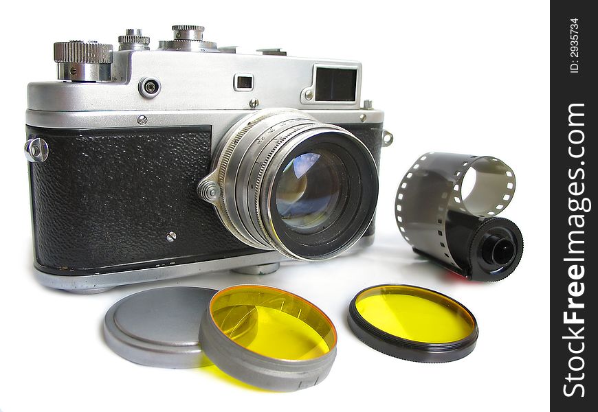 Isolated vintage camera with photofilters and negativ film on white background.