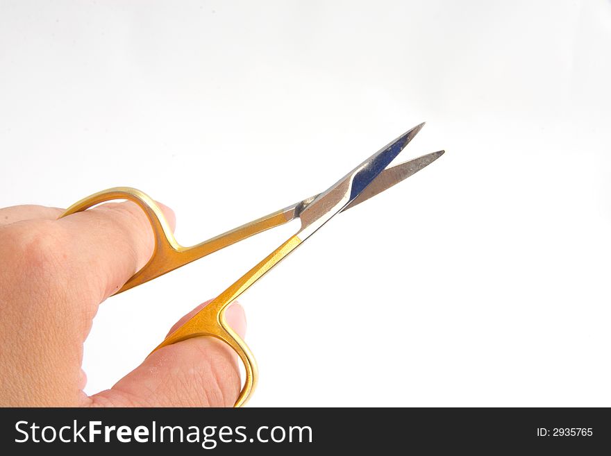 Photo of the scissors in hand isolated on a white background