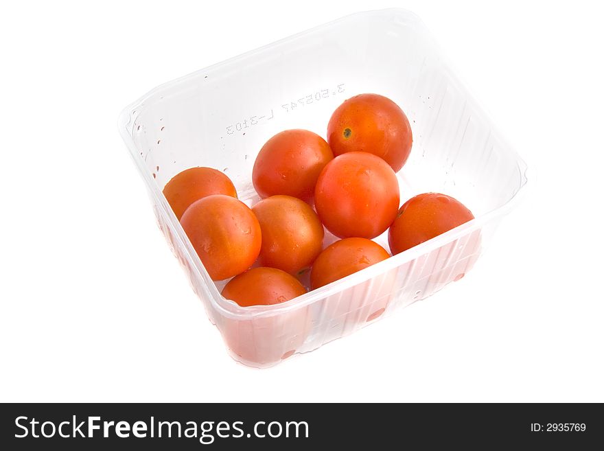 Photo of a tomatoes in a punnet isolated on white background