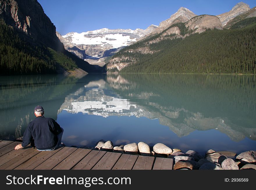 From Lake Louise in Banff National Park, Alberta, Canada.  Here is a visitor enjoying the famous view of Lake Louise. From Lake Louise in Banff National Park, Alberta, Canada.  Here is a visitor enjoying the famous view of Lake Louise.