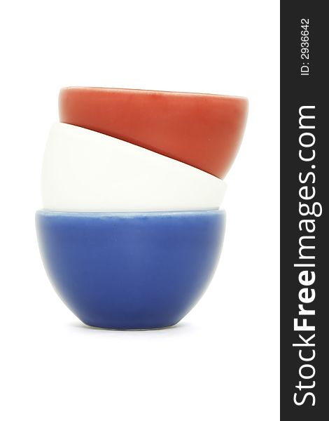 A blue, white and red bowl stacked, isolated on white. A blue, white and red bowl stacked, isolated on white.