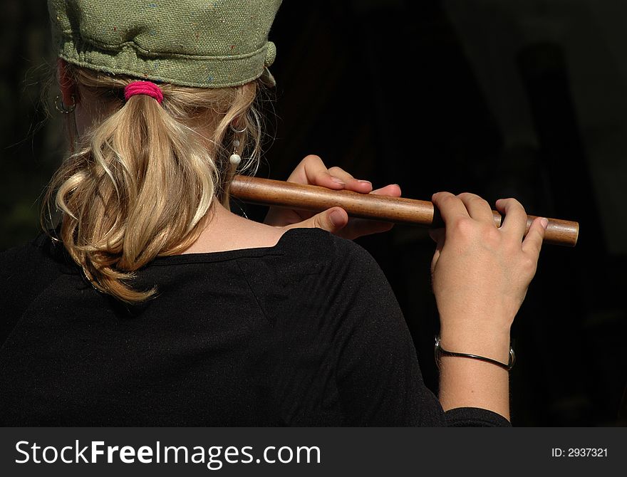 Young girl playing a recorder. Young girl playing a recorder
