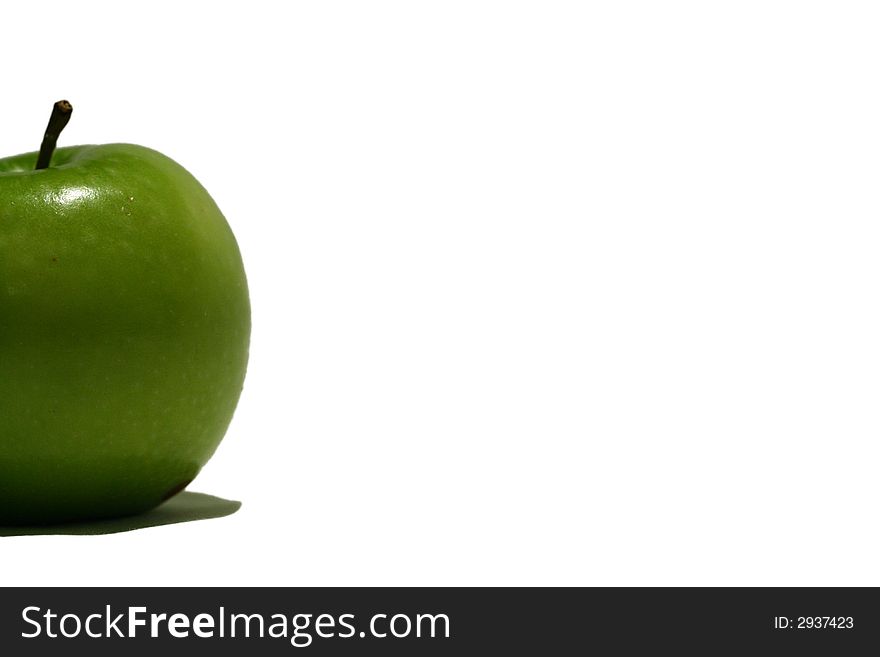 A fresh green apple on a white background. A fresh green apple on a white background