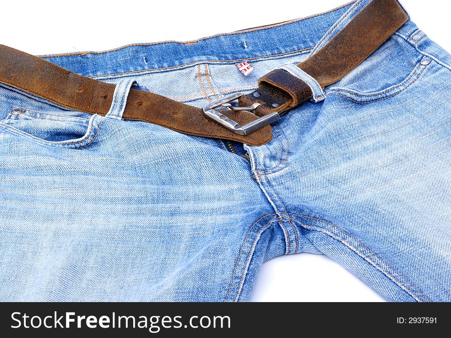 Part of female jeans with brown leather belt. Part of female jeans with brown leather belt.