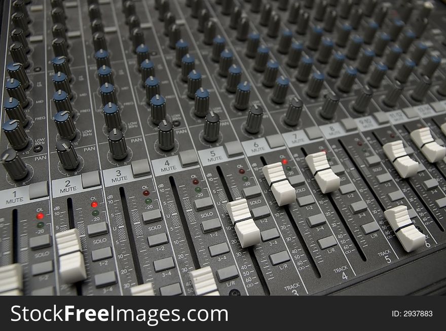 Closeup view of a DJ's mixing desk with shallow depth of field. Closeup view of a DJ's mixing desk with shallow depth of field