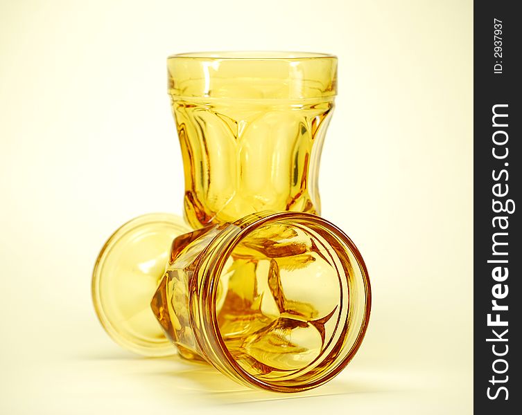 Chunky yellow stemmed drinking glasses for alcohol probably wine