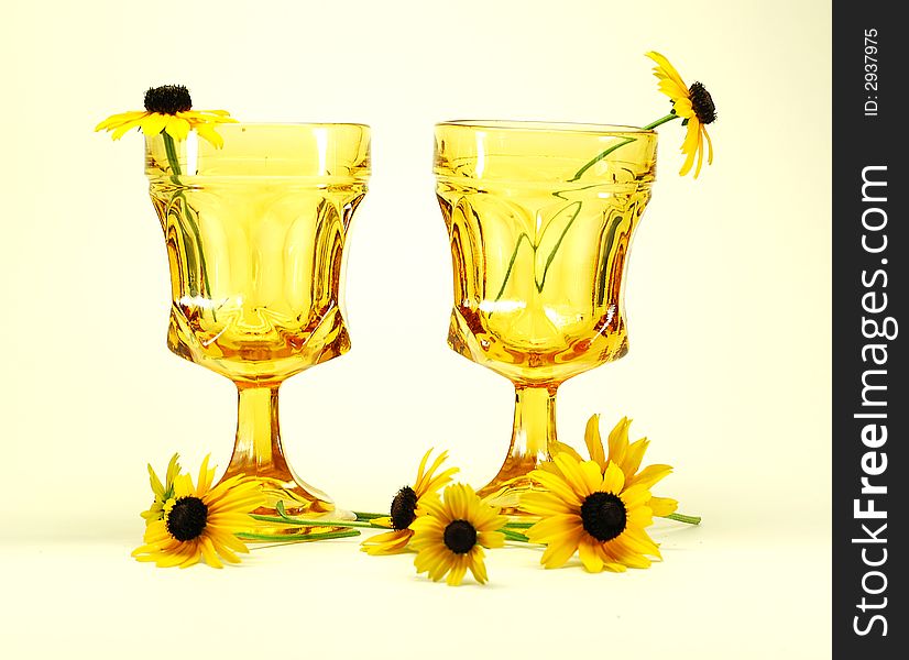 Black-eyed susans flowers and drinking glasses still life. Black-eyed susans flowers and drinking glasses still life