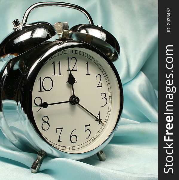 Alarm-clock on blue background wakeup