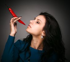 Woman Holding Red Hot Chili Pepper In Mouth Royalty Free Stock Photography Woman Holding Red Hot Chili Pepper In Mouth Royalty Free Stock Photography