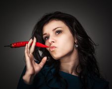 Woman Holding Red Hot Chili Pepper In Mouth Royalty Free Stock Images Woman Holding Red Hot Chili Pepper In Mouth Royalty Free Stock Images