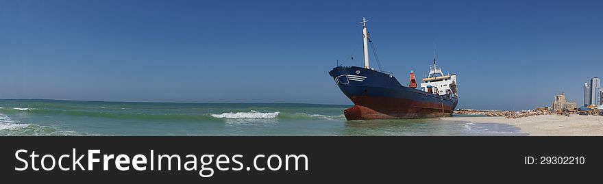 A large cargo ship runs aground off the coast of Ajman, UAE. A large cargo ship runs aground off the coast of Ajman, UAE.